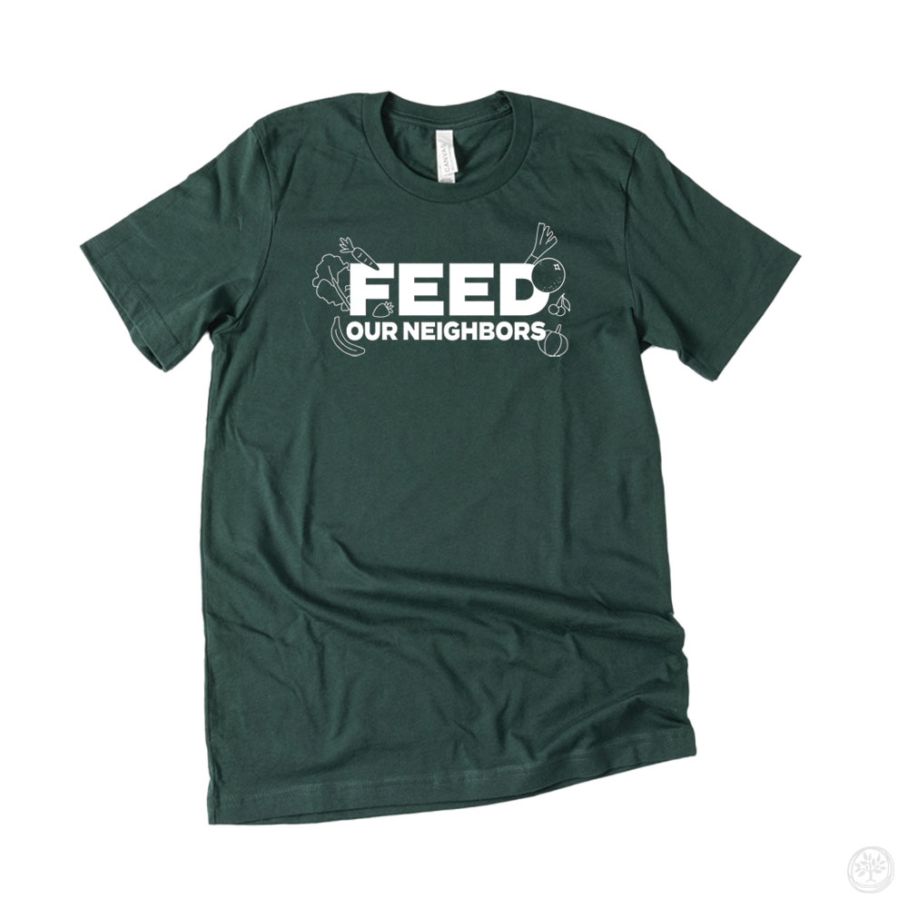 Dark green t-shirt with bold white text “Feed Our Neighbors” surrounded by subtle line art of vegetables – hunger relief nonprofit design supporting local food distribution.