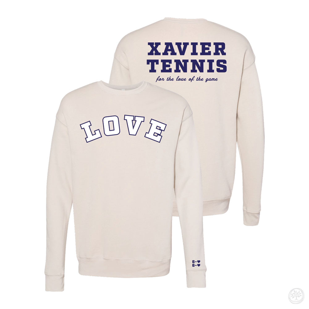 Cream-colored crewneck sweatshirt with the word "LOVE" in bold varsity lettering on the front and "Xavier Tennis – for the love of the game" printed on the back in navy blue.