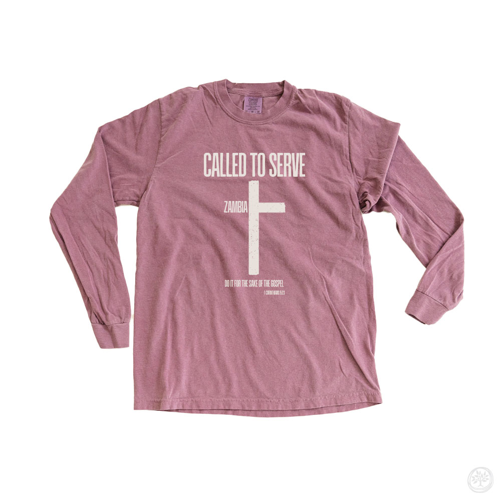 Mauve long sleeve ‘Called to Serve’  Alt text: “Mauve long sleeve tee with white cross and bold text reading: ‘Called to Serve – Zambia,’ with a Bible verse below.”